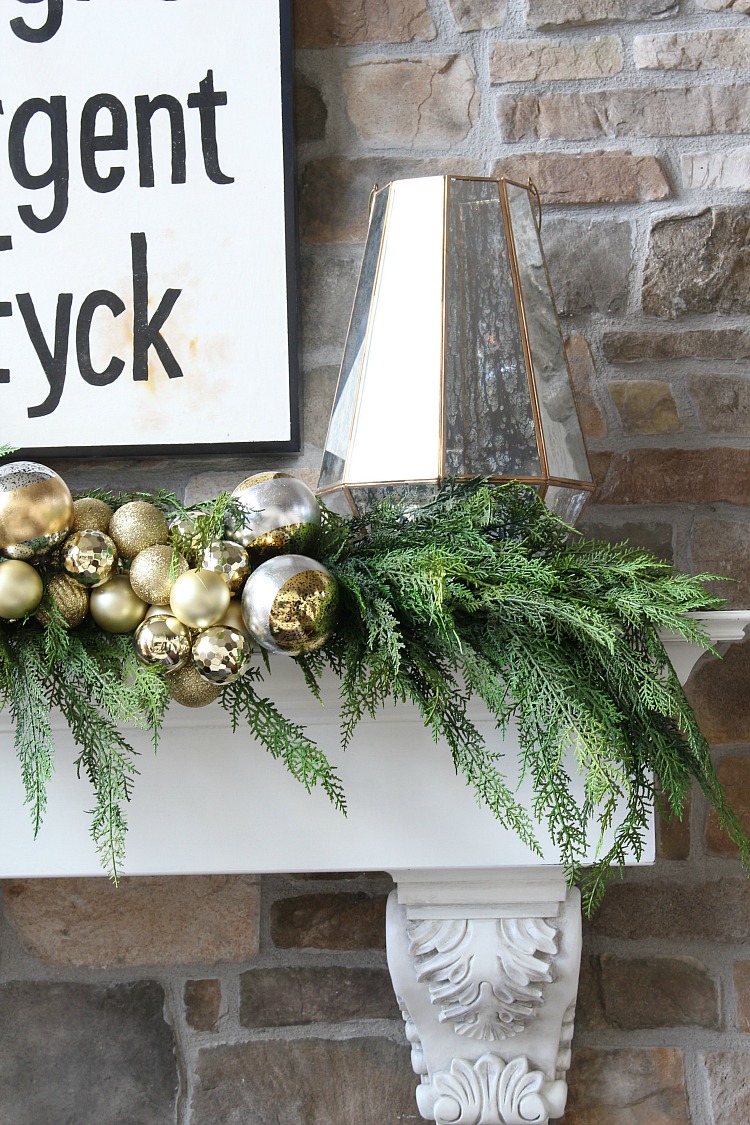 gold-ornament-garland-fireplace-mantel