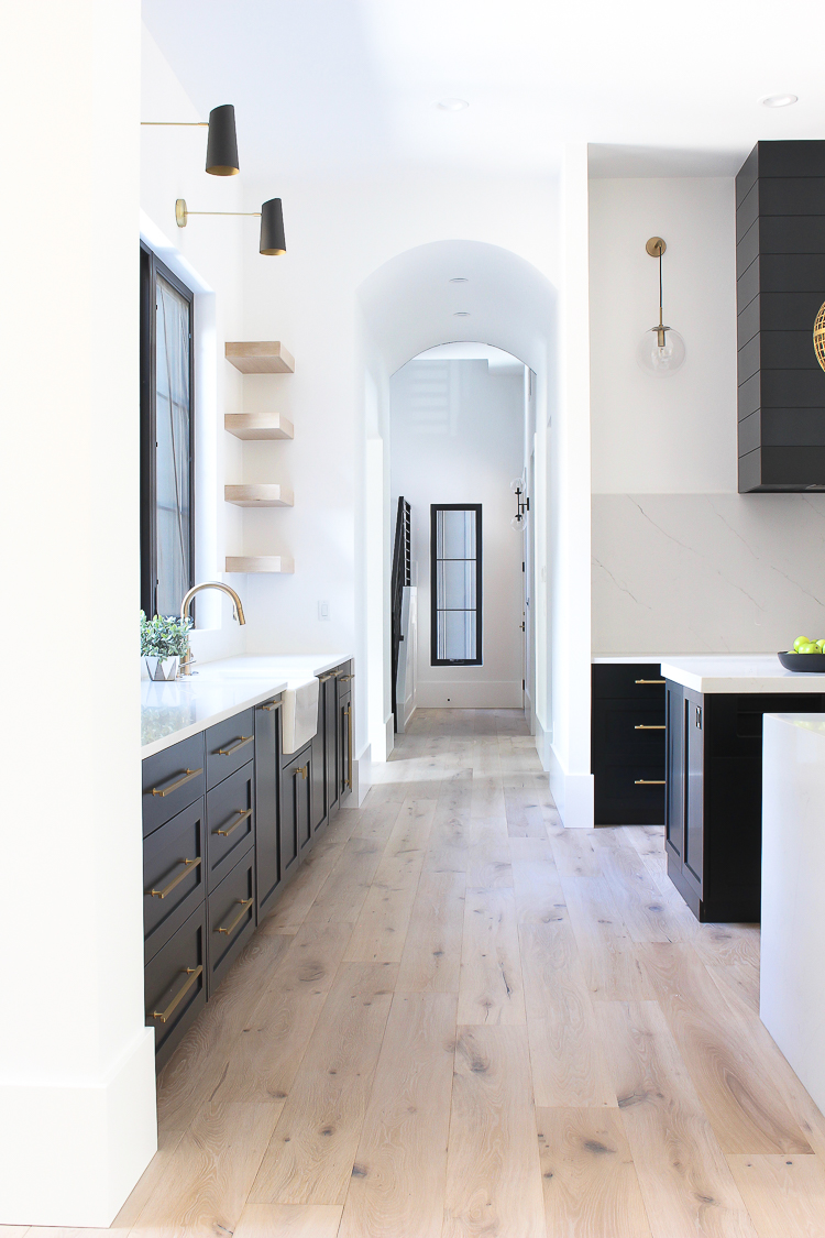 Modern kitchen black cabinets white oak open shelving double islands