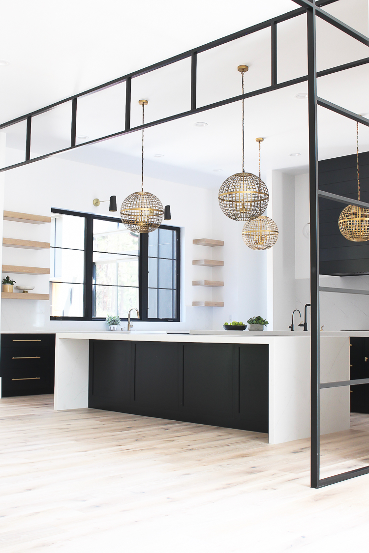 Modern Kitchen with Black and Rift Sawn White Oak cabinets with open shelves and steel transoms