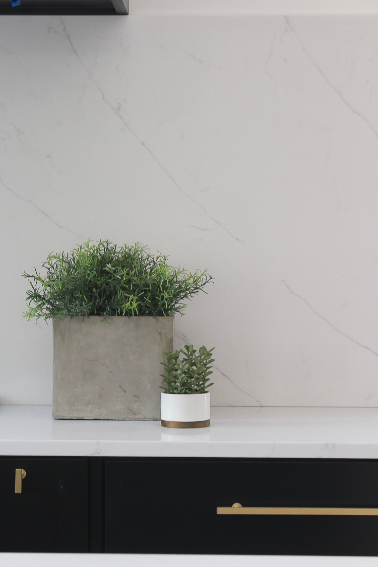 quartz slab backsplash in modern kitchen