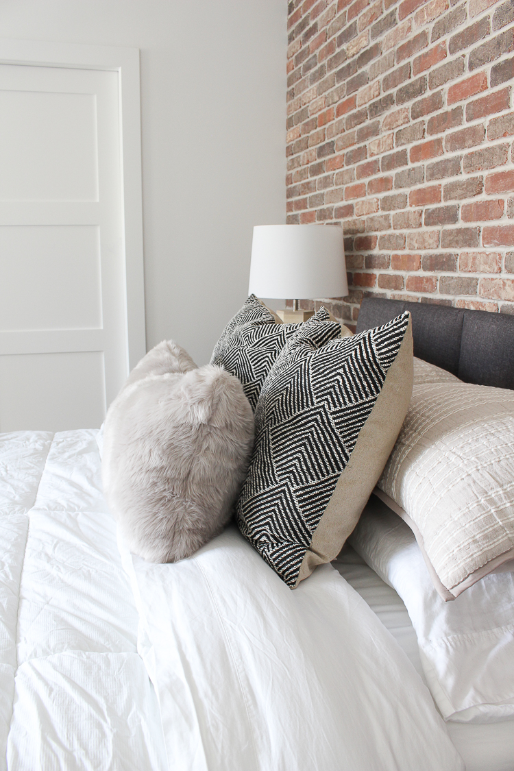 modern industrial mid-century bedroom brick walls