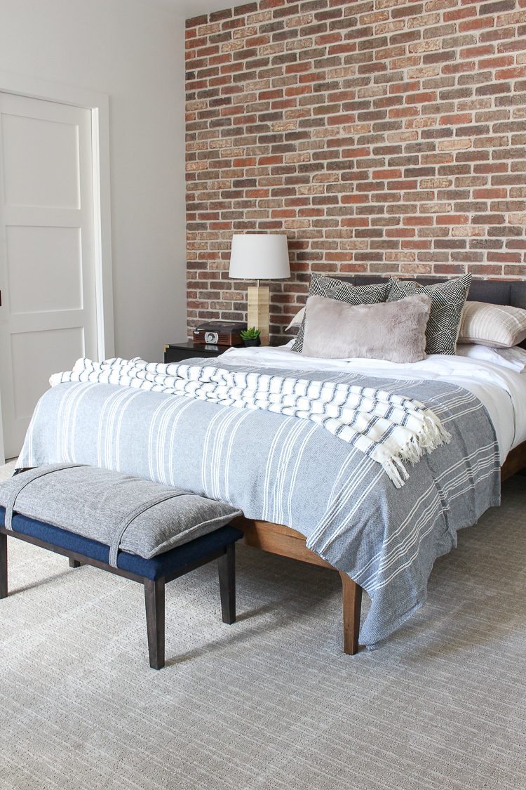 industrial modern midcentury boy bedroom with brick walls