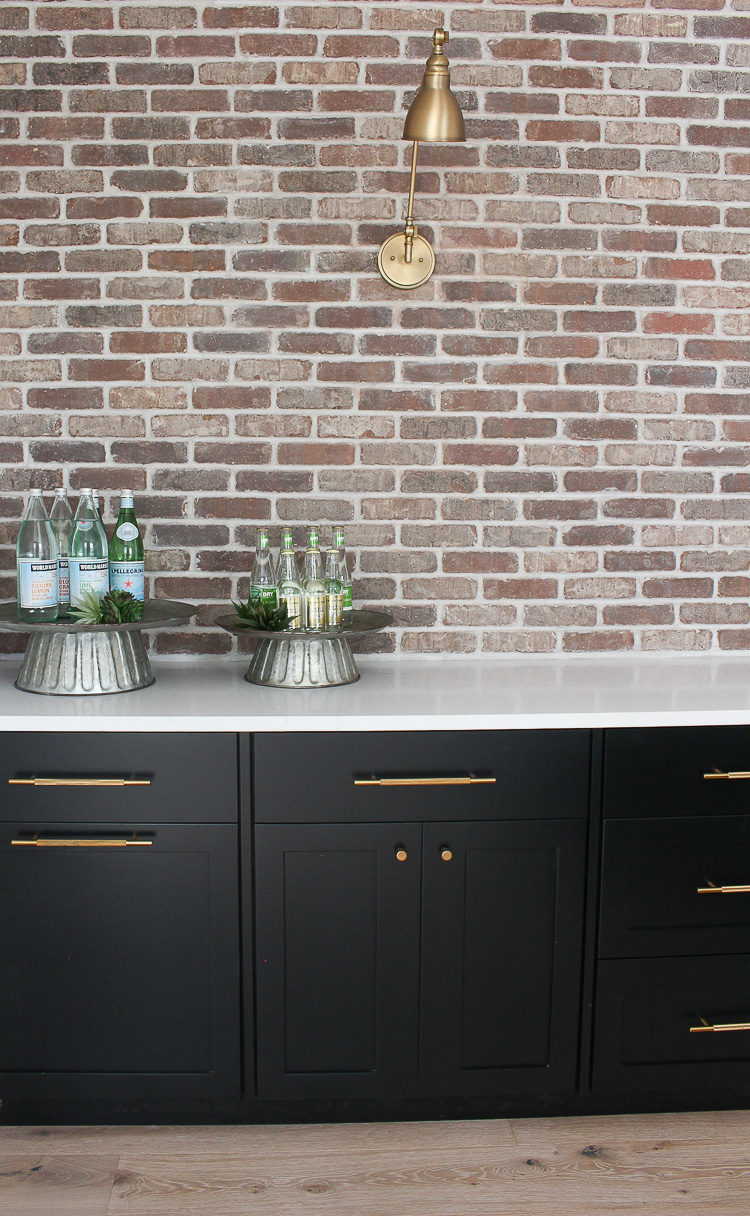 industrial modern bar with brick wall black cabinets