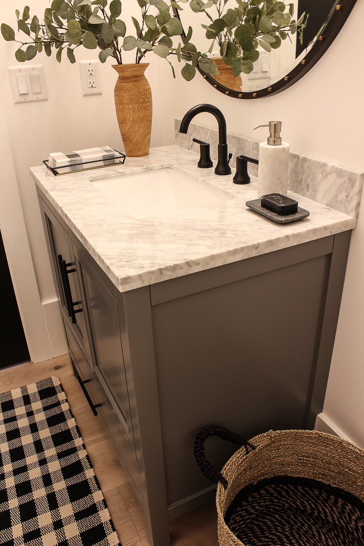 bathroom-gray-vanity-black-faucet-hardware
