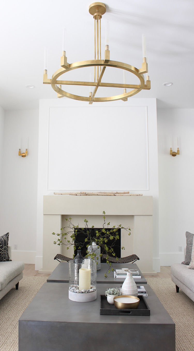 modern limestone fireplace in neutral living room space