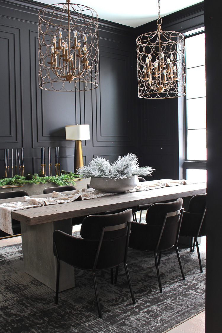 moody dramatic black dining room with modern moulding details