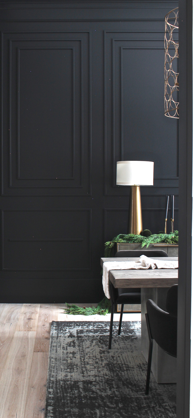 moody dramatic black dining room with modern moulding details