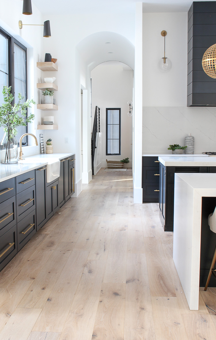 Airy kitchen design with white oak floating shelves