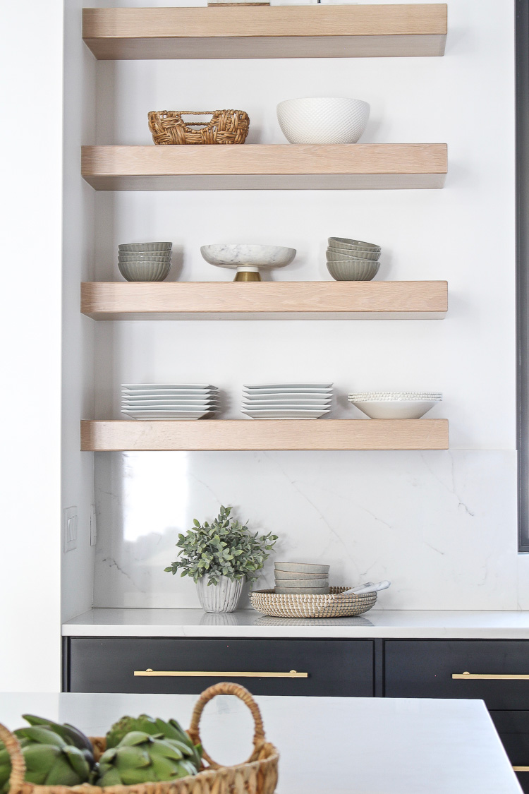 floating white oak shelves in kitchen