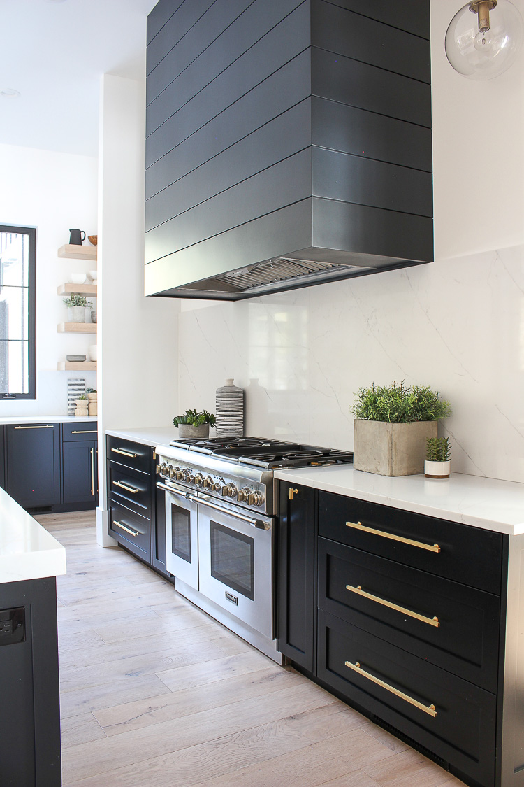 https://thehouseofsilverlining.com/wp-content/uploads/2019/01/transitional-modern-kitchen-rift-sawn-white-oak-mixed-with-black-cabinets-double-islands-55.jpg