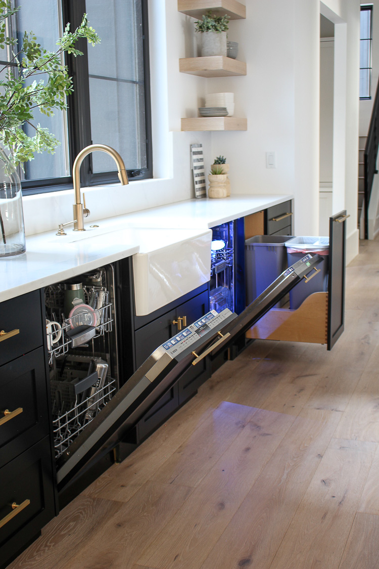 Most people store drinking glasses in wall cabinets near the sink