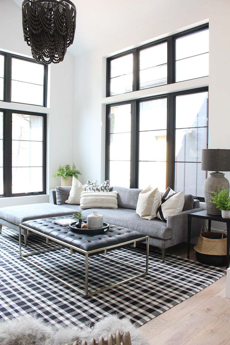 modern-casual-living-room-with-arched-ceiling-beams-black-shiplap-fireplace