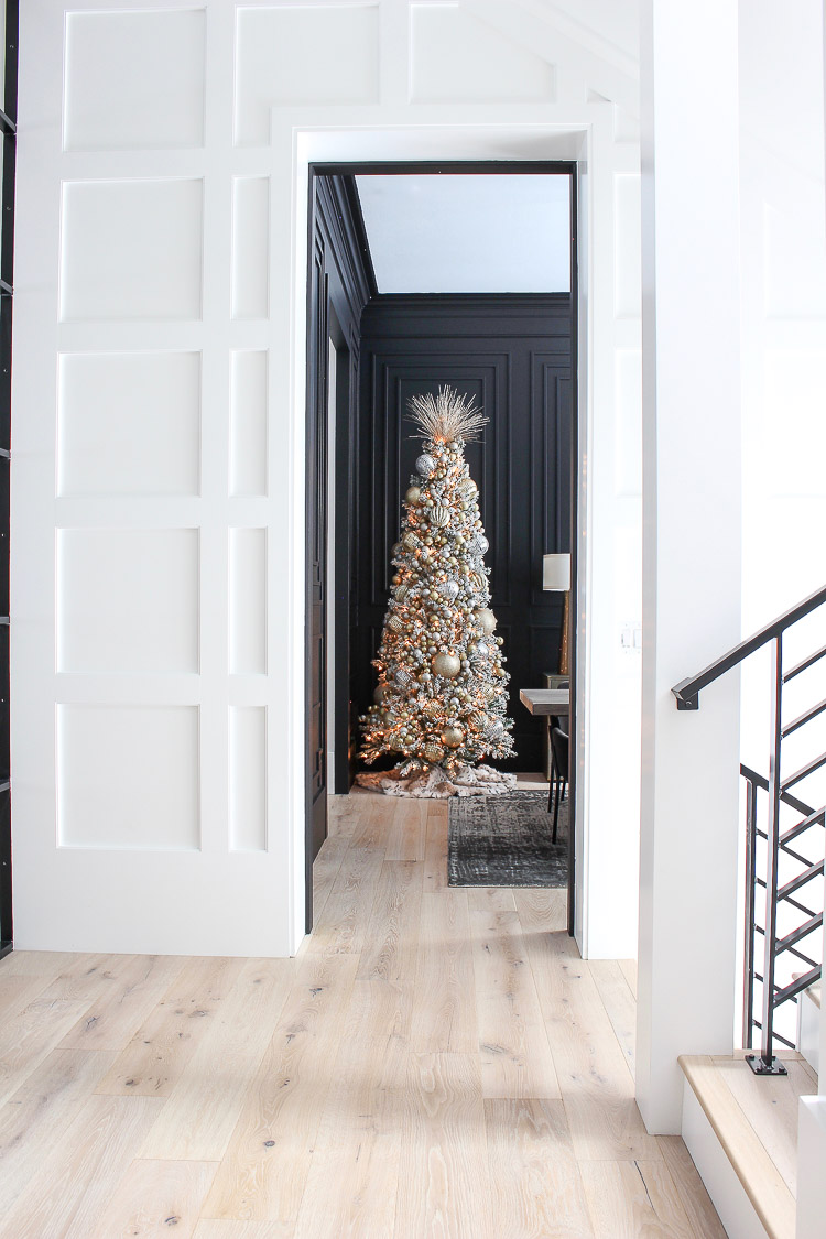 elegant-flocked-christmas-tree-modern-black-dining-room