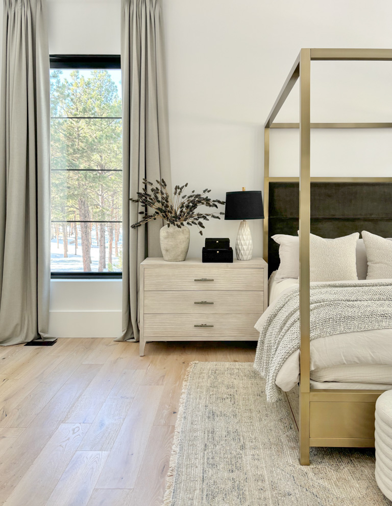 organic-modern-primary-master-bedroom-vaulted-ceiling-wood-beam-gold-canopy-bed-mountain-home