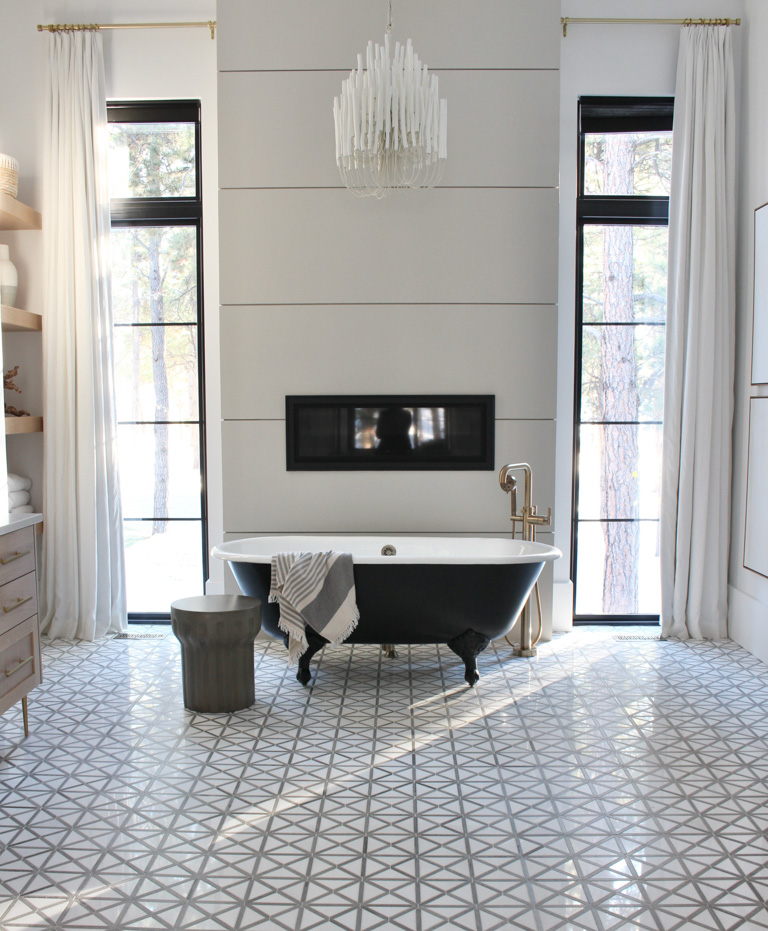  primary-master-bath-marble-floor-large-dramatic-windows-black-clawfoot-tub-vintage-modern-style